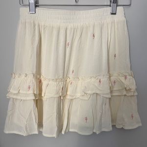 White skirt with bolts. Never worn,still with tags